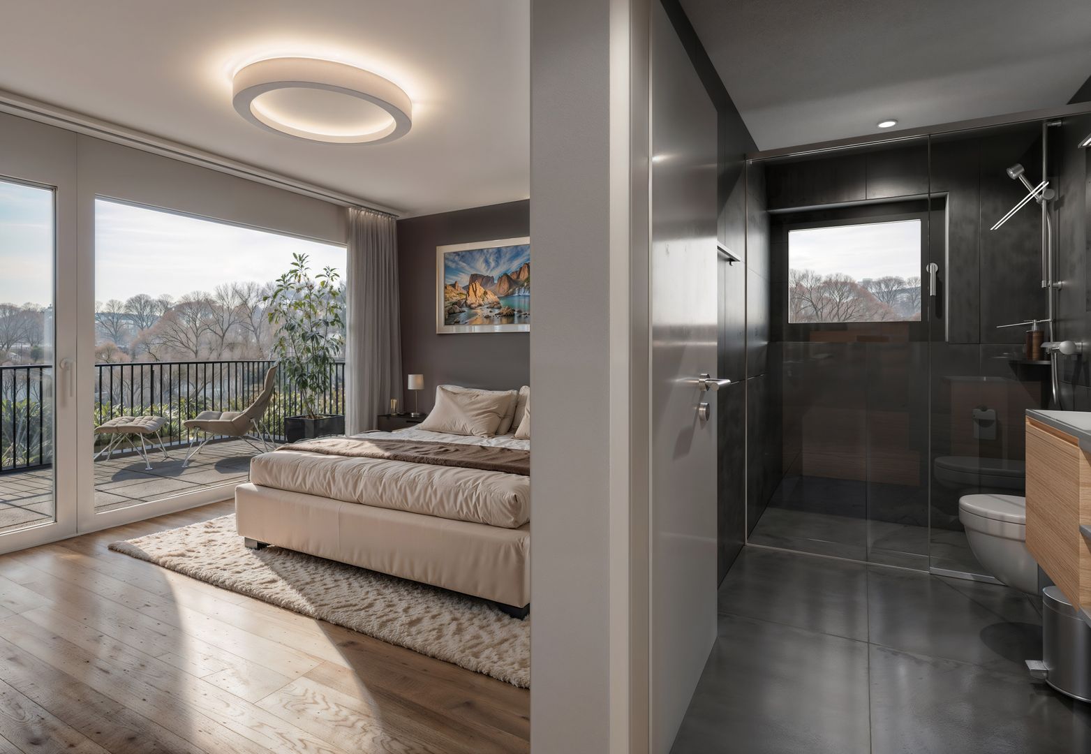 Schlafzimmer mit angrenzendem Badezimmer und Balkonblick