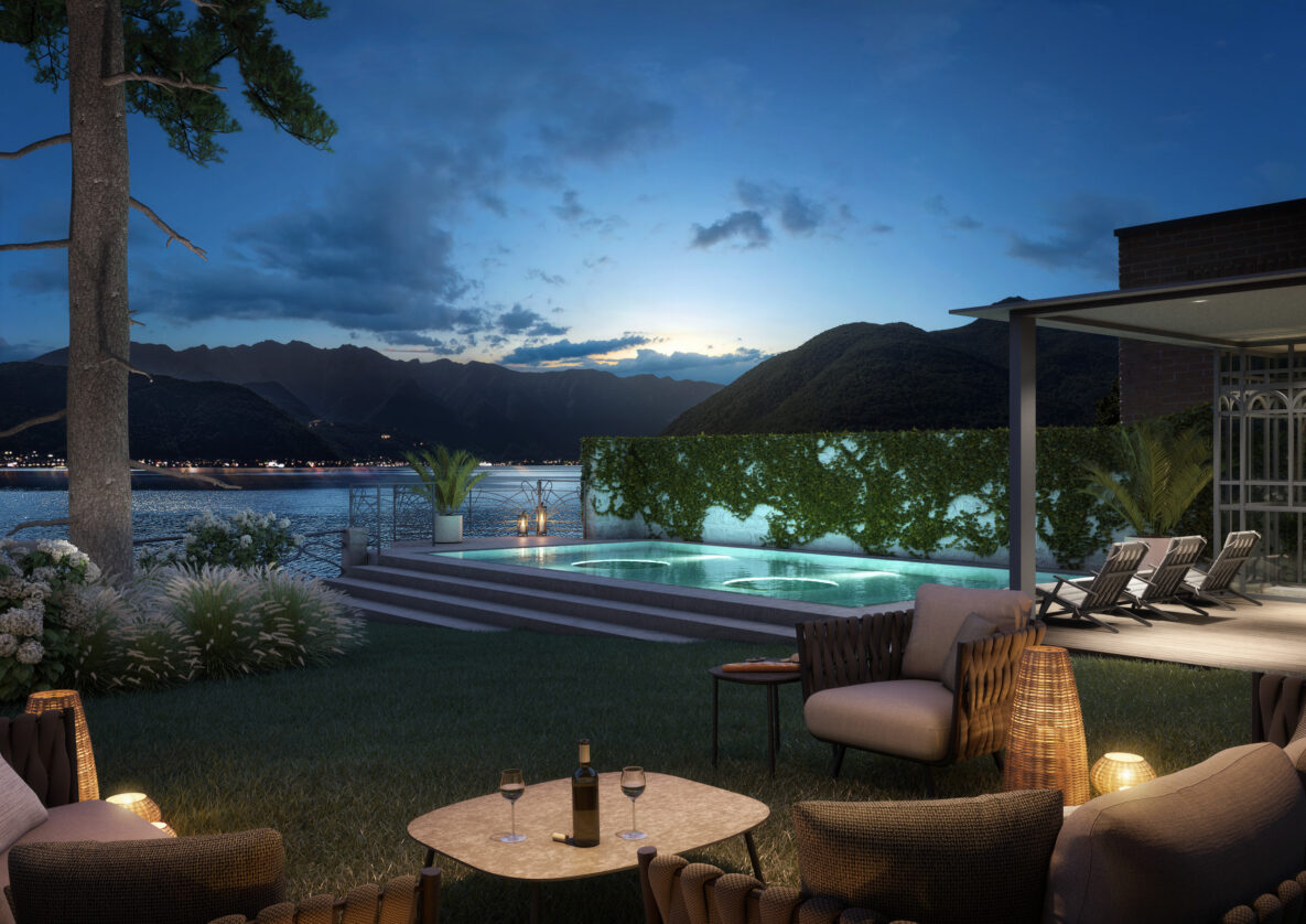Luxuriöse Außenlounge am Wasser mit Pool bei Dämmerung