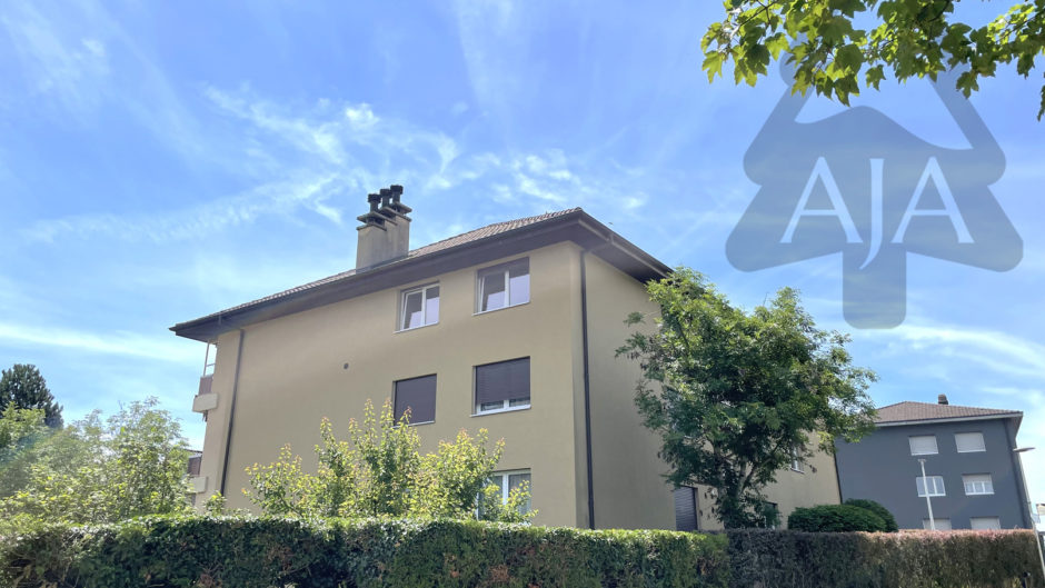 Mehrfamilienhaus mit Gartenansicht