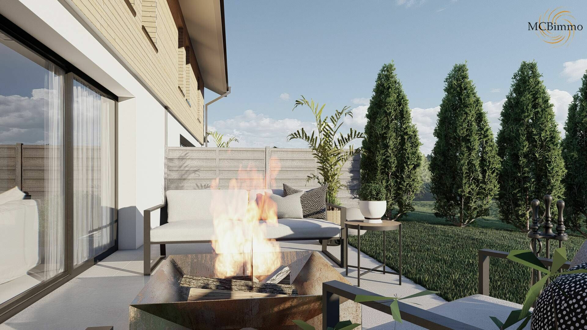Terrasse mit Feuerstelle und Gartenblick