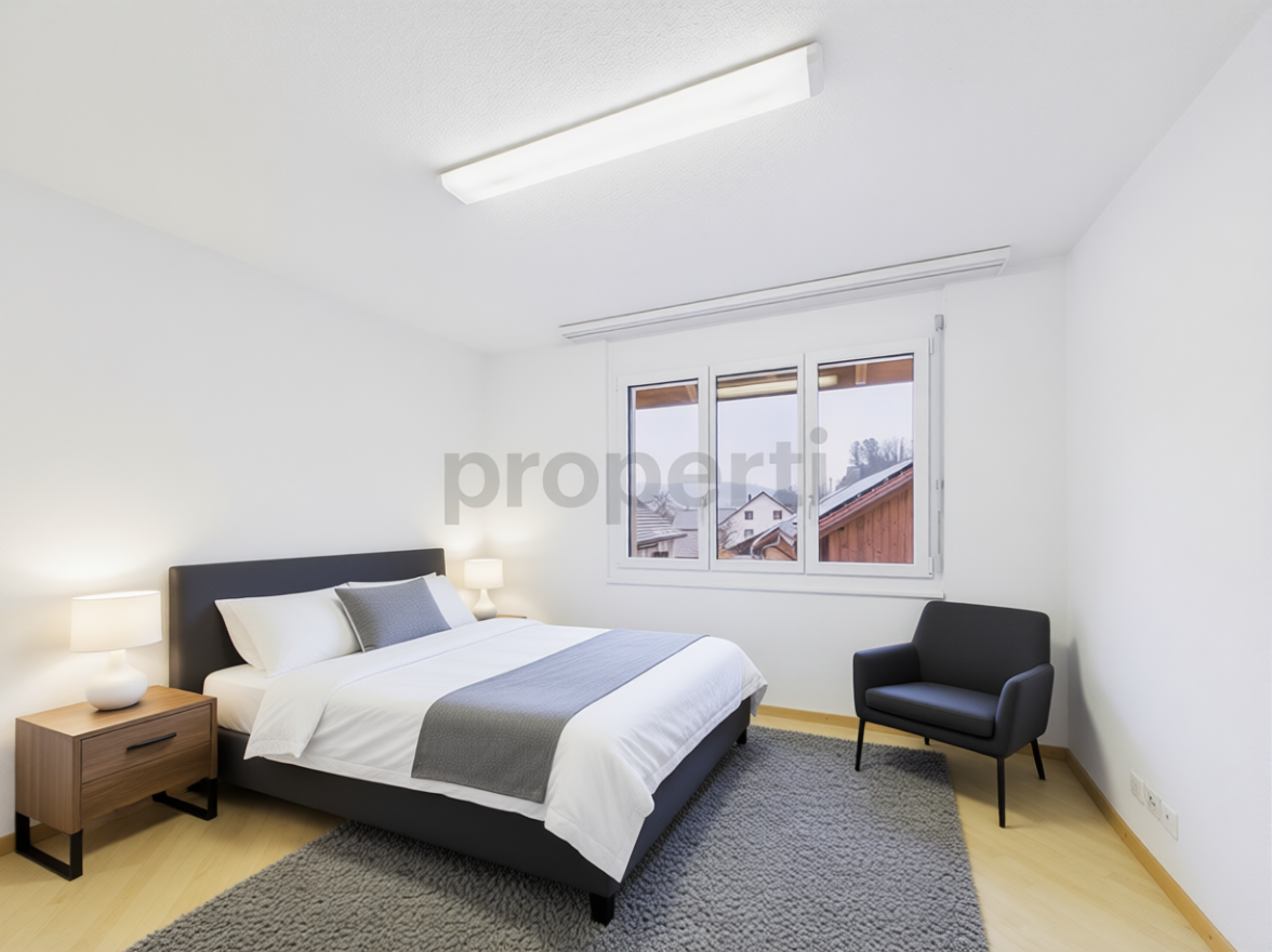 Modernes Schlafzimmer mit Einzelmöbeln und Tageslicht