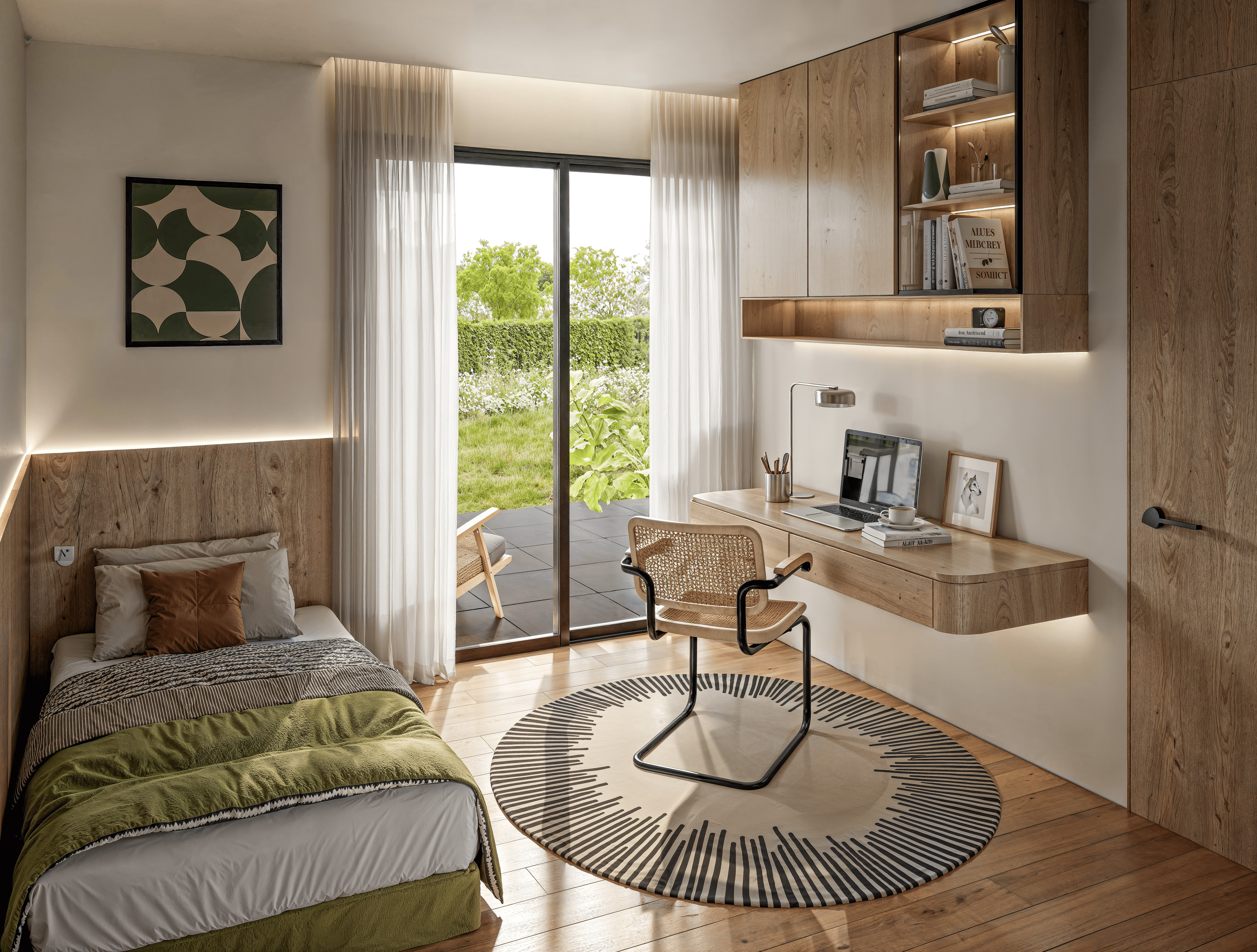 Modernes Schlafzimmer mit Arbeitsbereich und Gartenausblick
