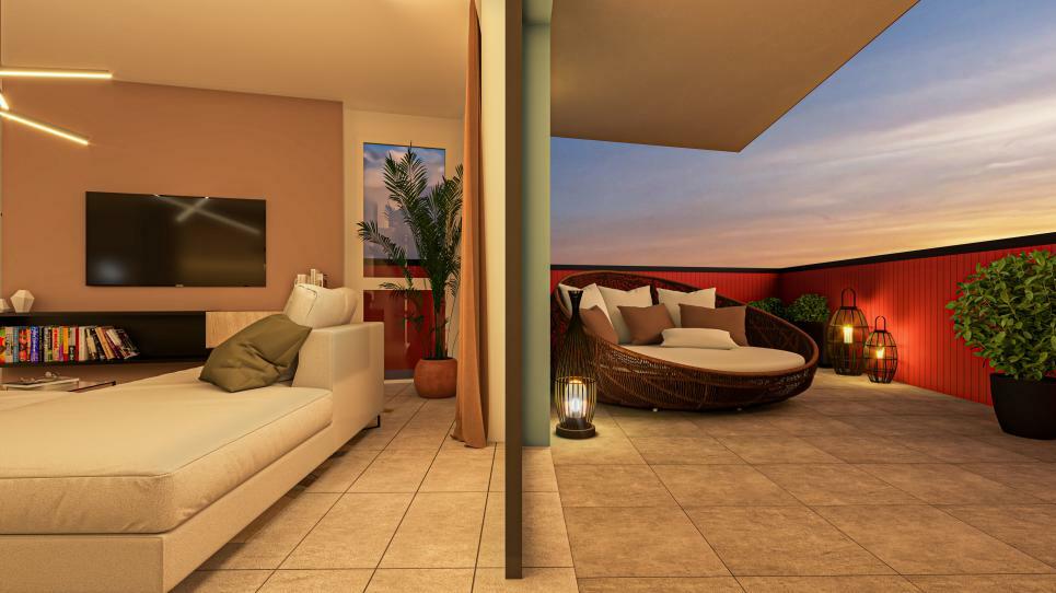 Wohnzimmer mit angrenzender Terrasse bei Sonnenuntergang