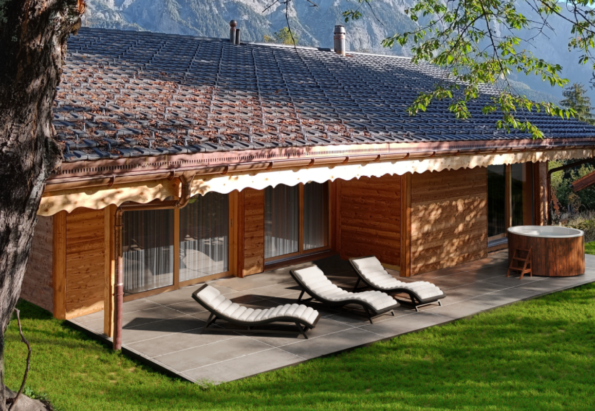 Holzhaus mit Terrasse und Whirlpool