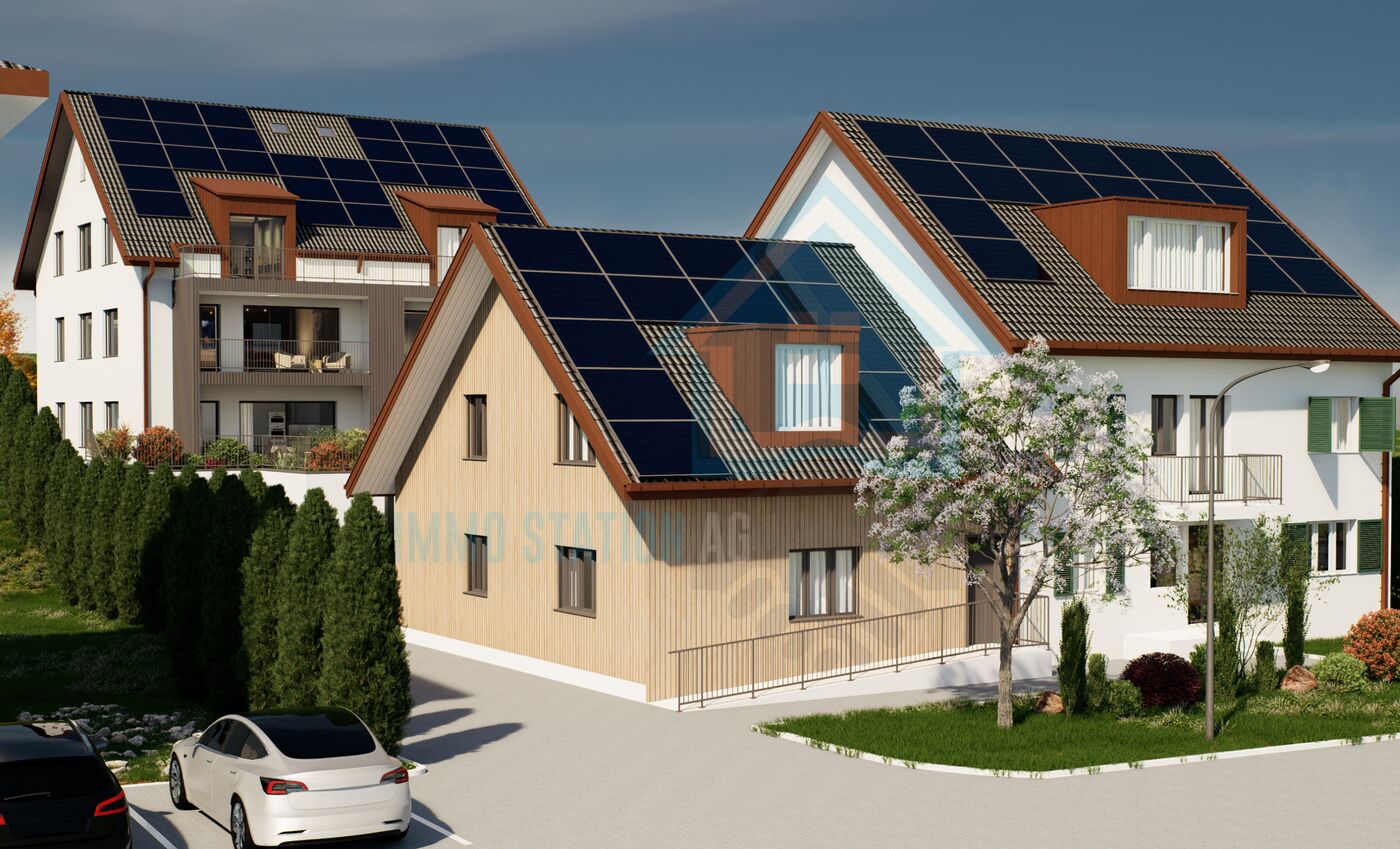 Außenansicht moderner Wohnhäuser mit Solardächern