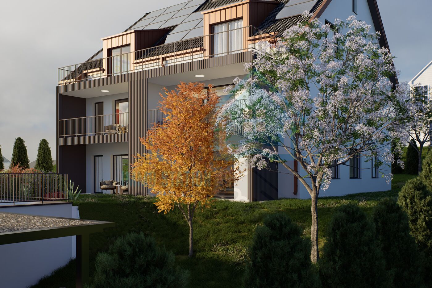 Modernes Mehrfamilienhaus mit Gartenansicht