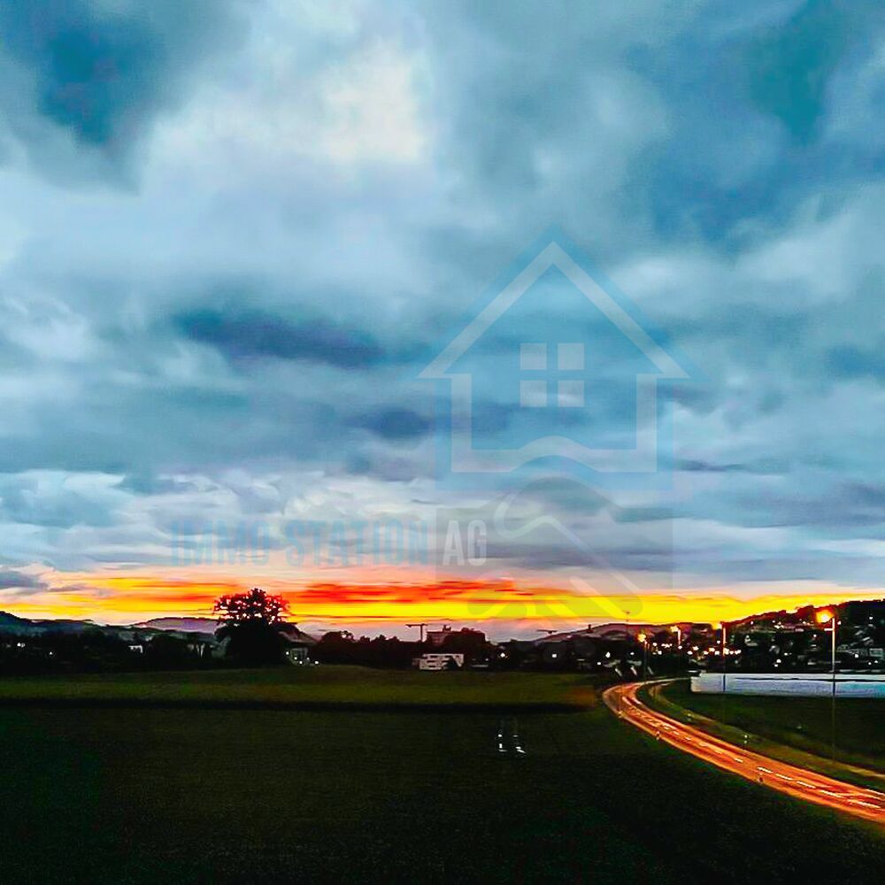 Landschaft bei Sonnenuntergang mit Wasserzeichen