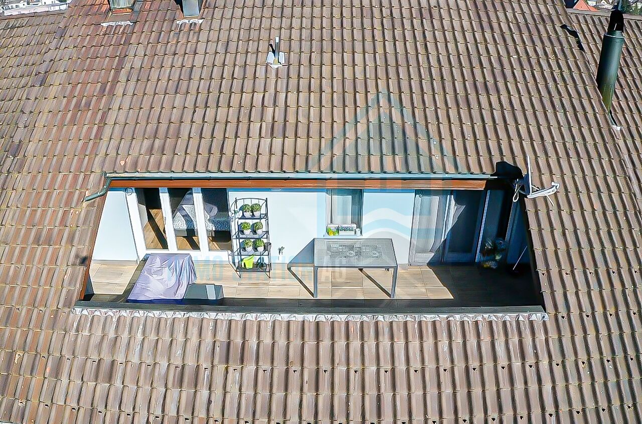Dachterrasse unter Ziegeldach