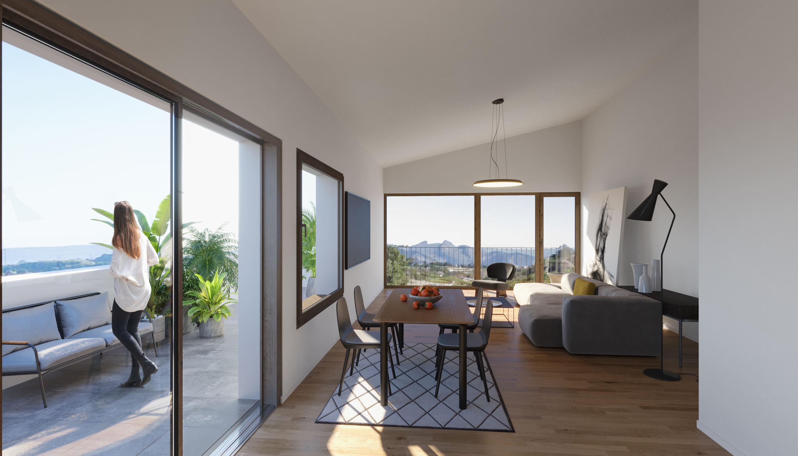 Wohn- und Essbereich mit Balkon und Bergblick