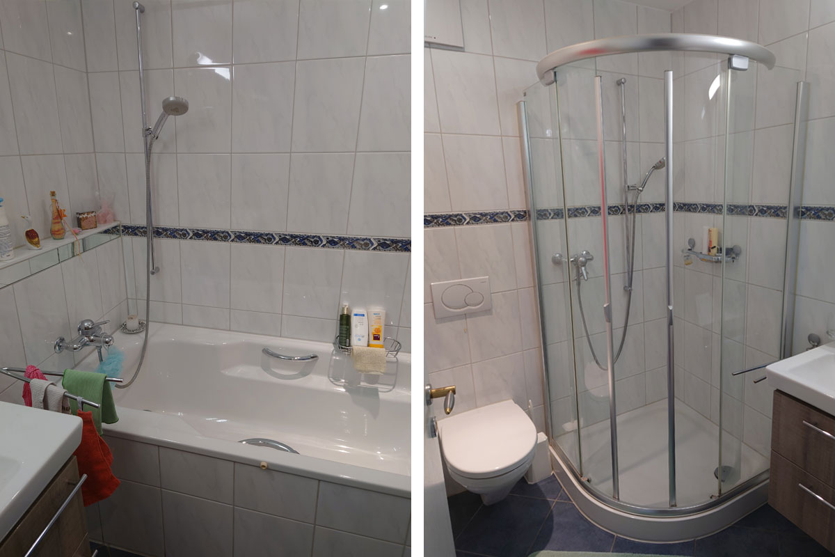 Badezimmer mit Badewanne und Duschkabine