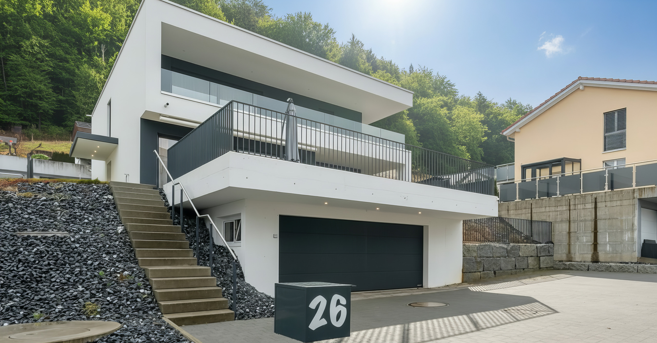 Modernes Einfamilienhaus mit Dachterrasse und Garagenzufahrt