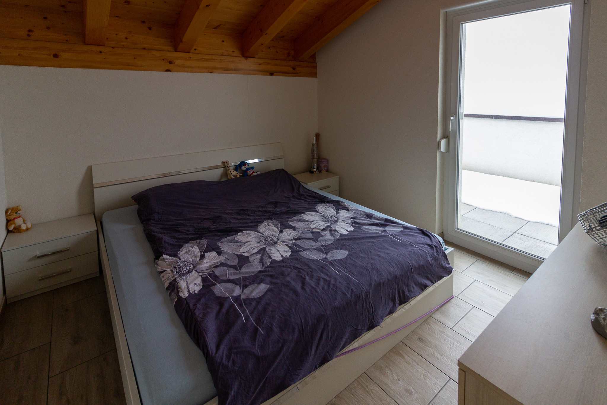 Schlafzimmer mit Balkonzugang