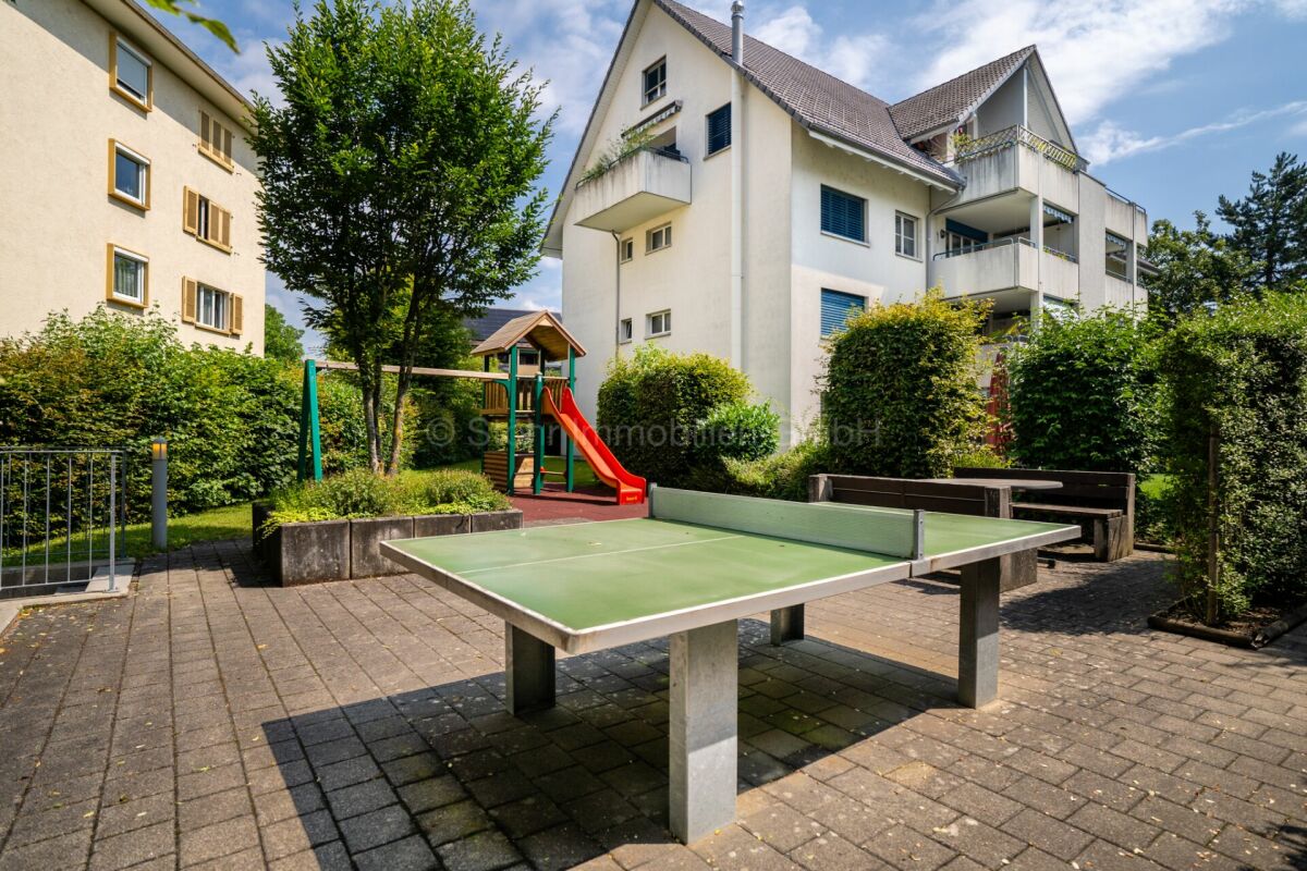 Gemeinschaftlicher Außenbereich mit Spiel- und Freizeitfläche