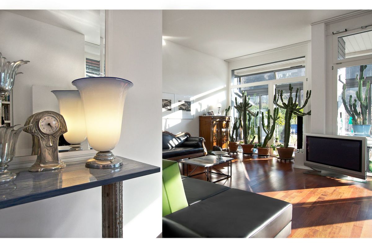 Helles Wohnzimmer mit großen Fenstern und Pflanzen