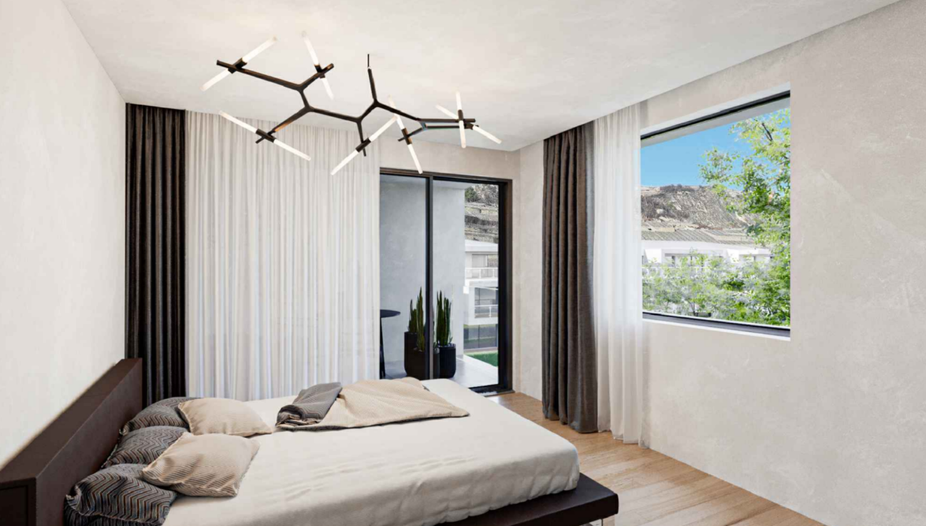 Modernes Schlafzimmer mit Balkon und Blick ins Grüne
