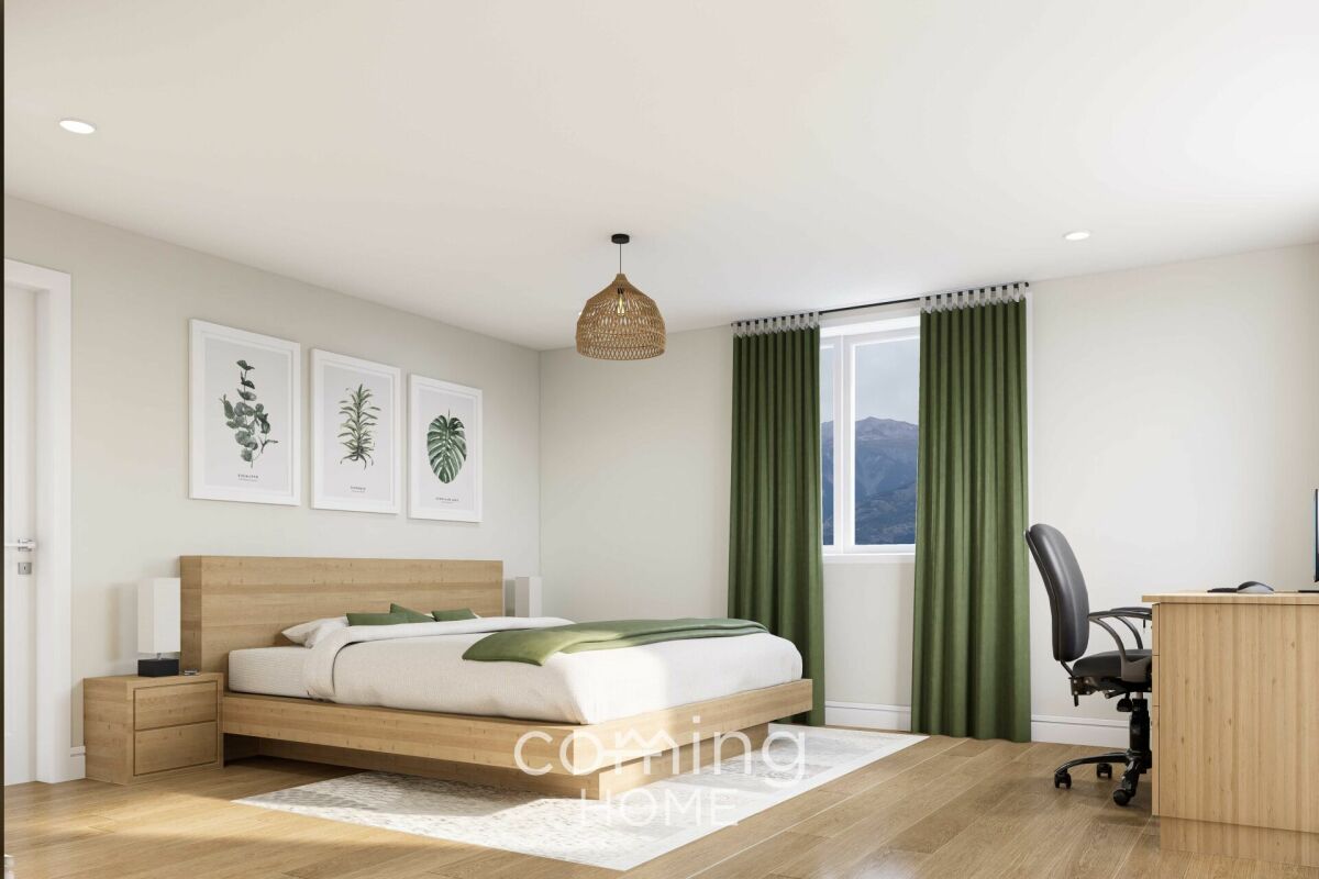 Helles Schlafzimmer mit Arbeitsplatz