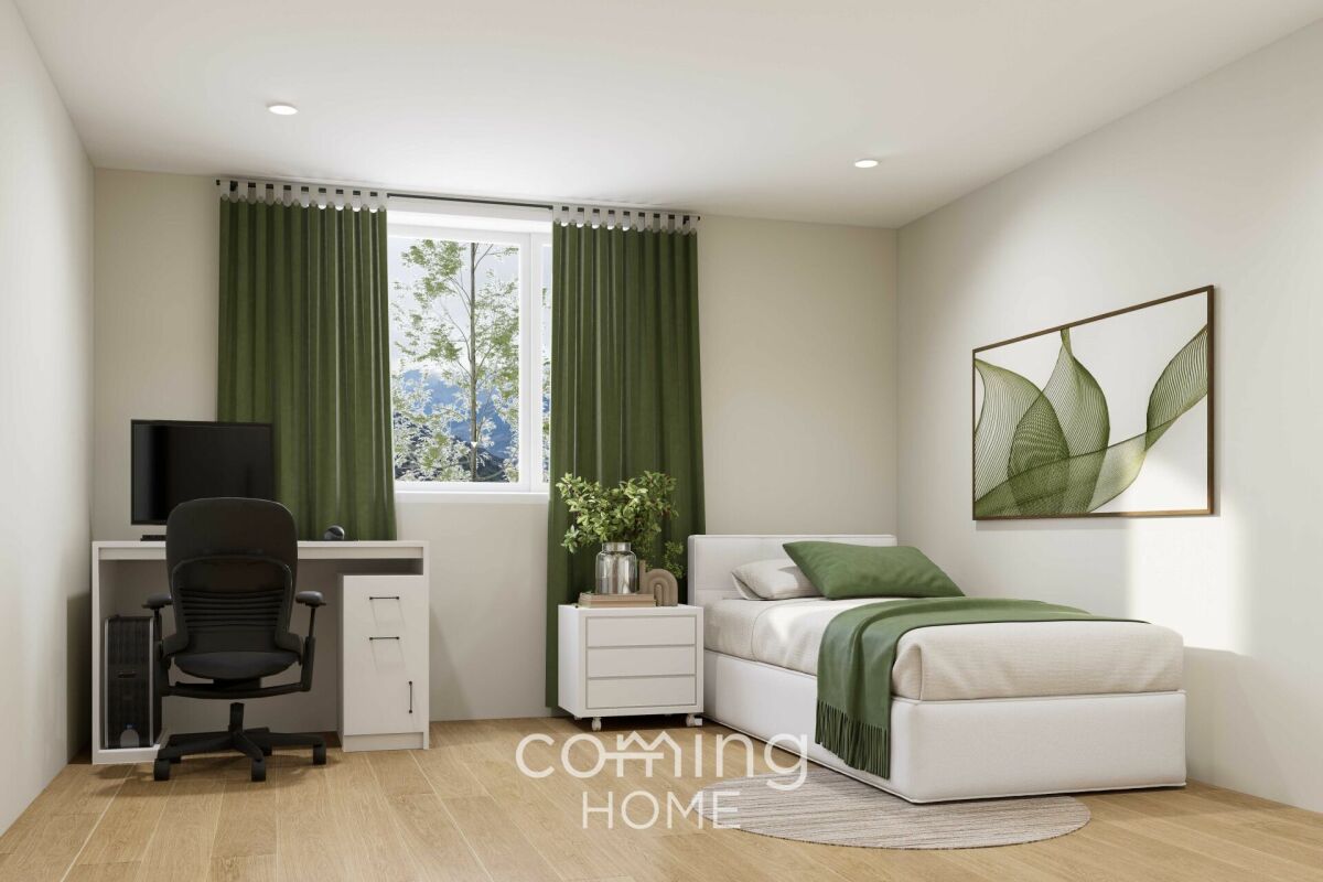 Helles Schlafzimmer mit Homeoffice-Ecke