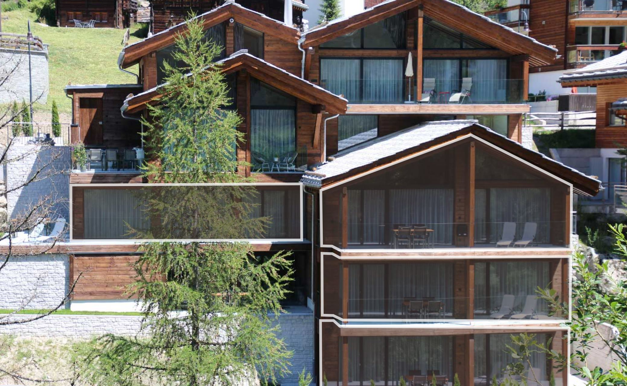 Alpines Mehrfamilienhaus mit Holzfassade