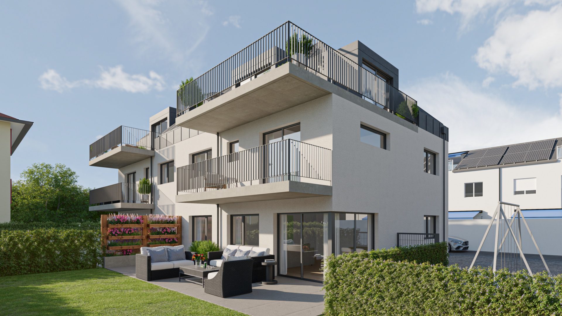 Moderne Wohnanlage mit Terrassen und Garten