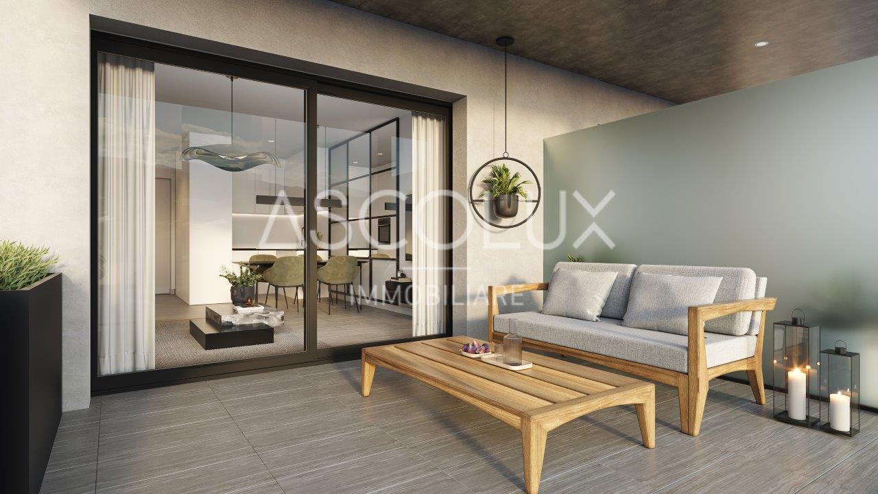 Überdachte Terrasse mit Lounge-Möbeln