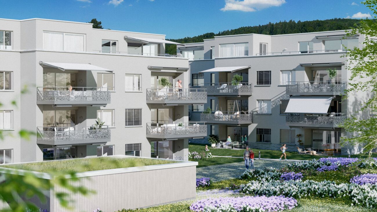 Moderne Wohnanlage mit Balkonen und Gemeinschaftsgarten