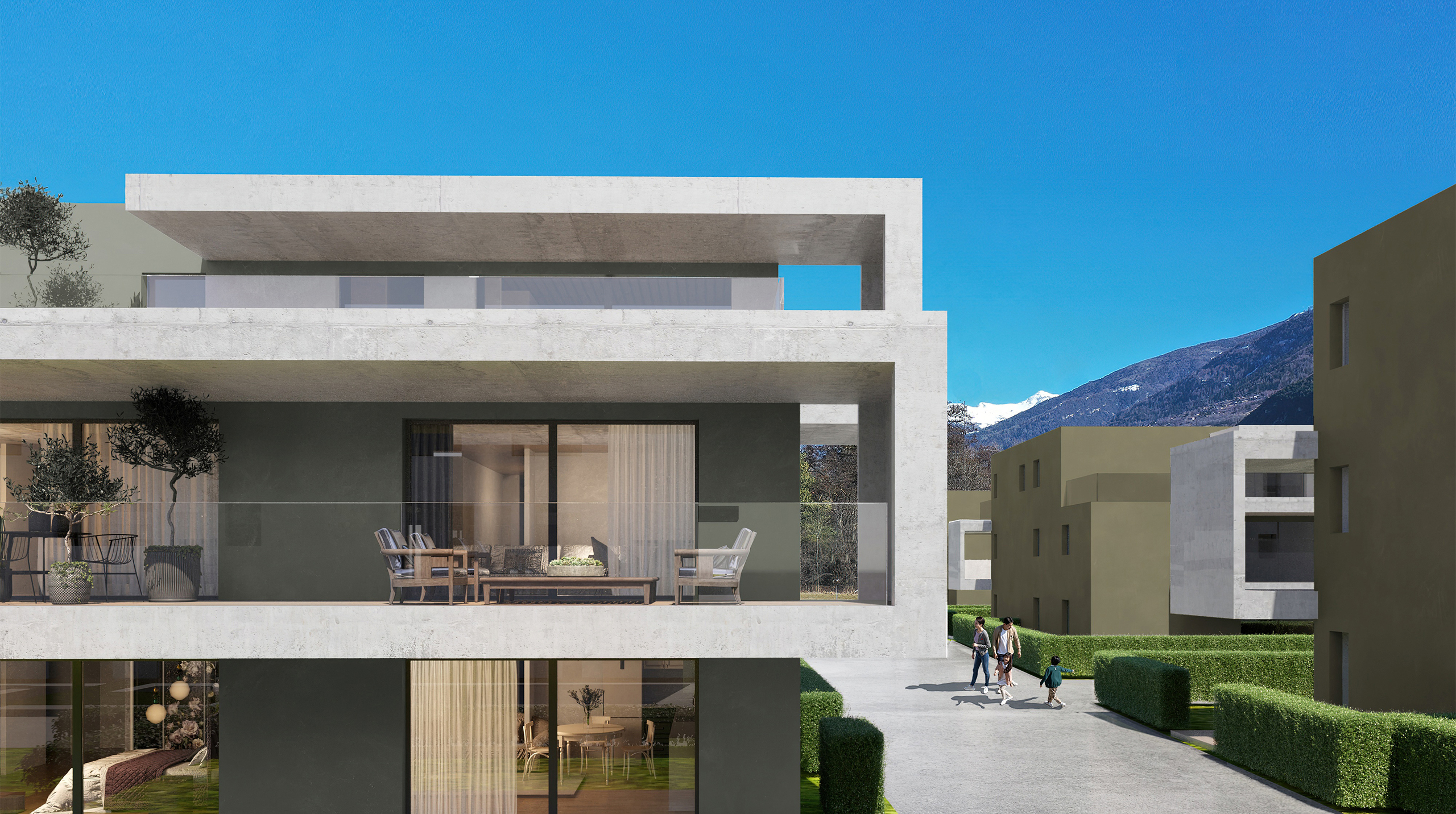 Moderne Wohnanlage mit Terrassen und Bergkulisse
