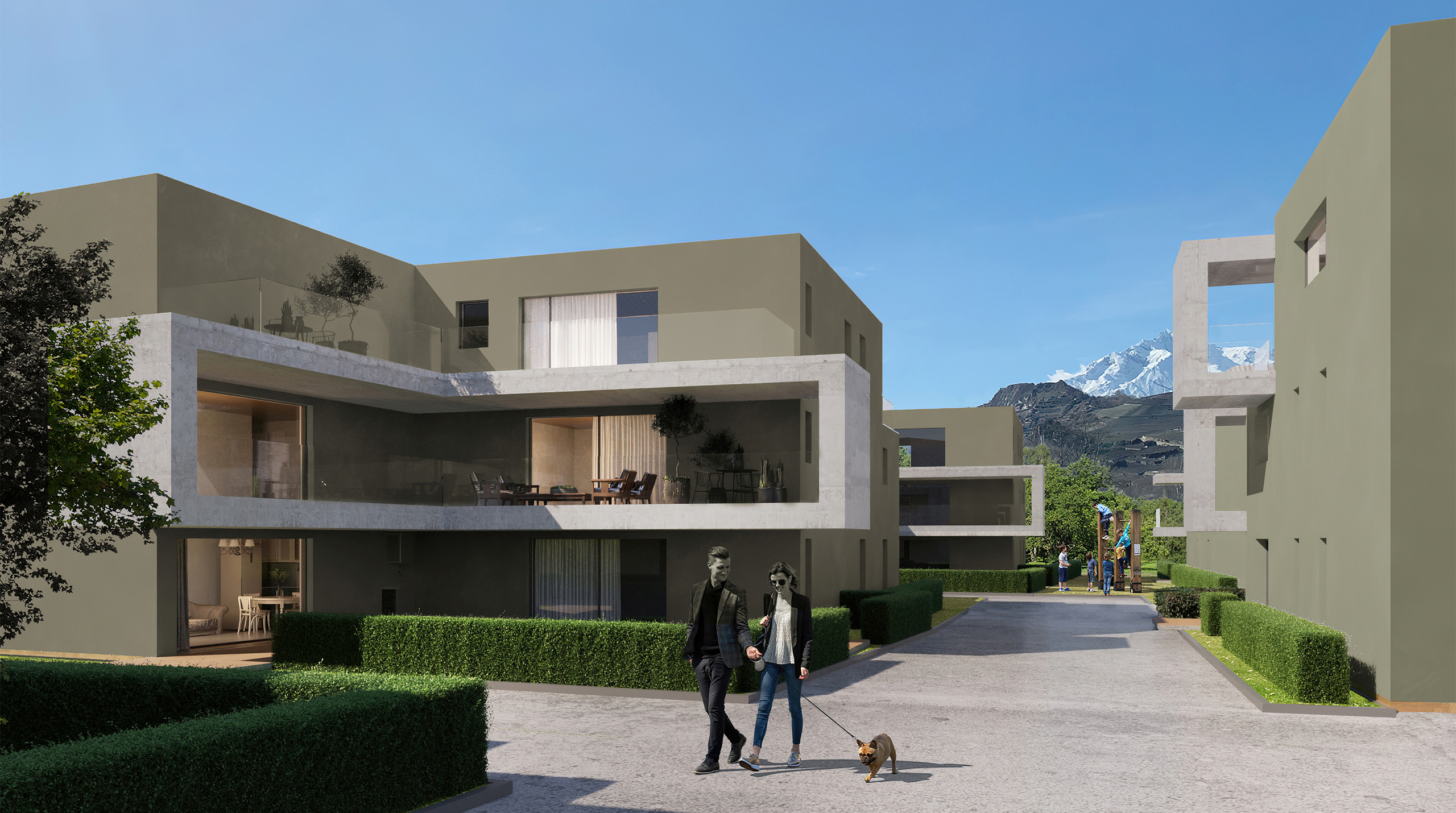 Moderne Wohnanlage mit Innenhof und Bergblick