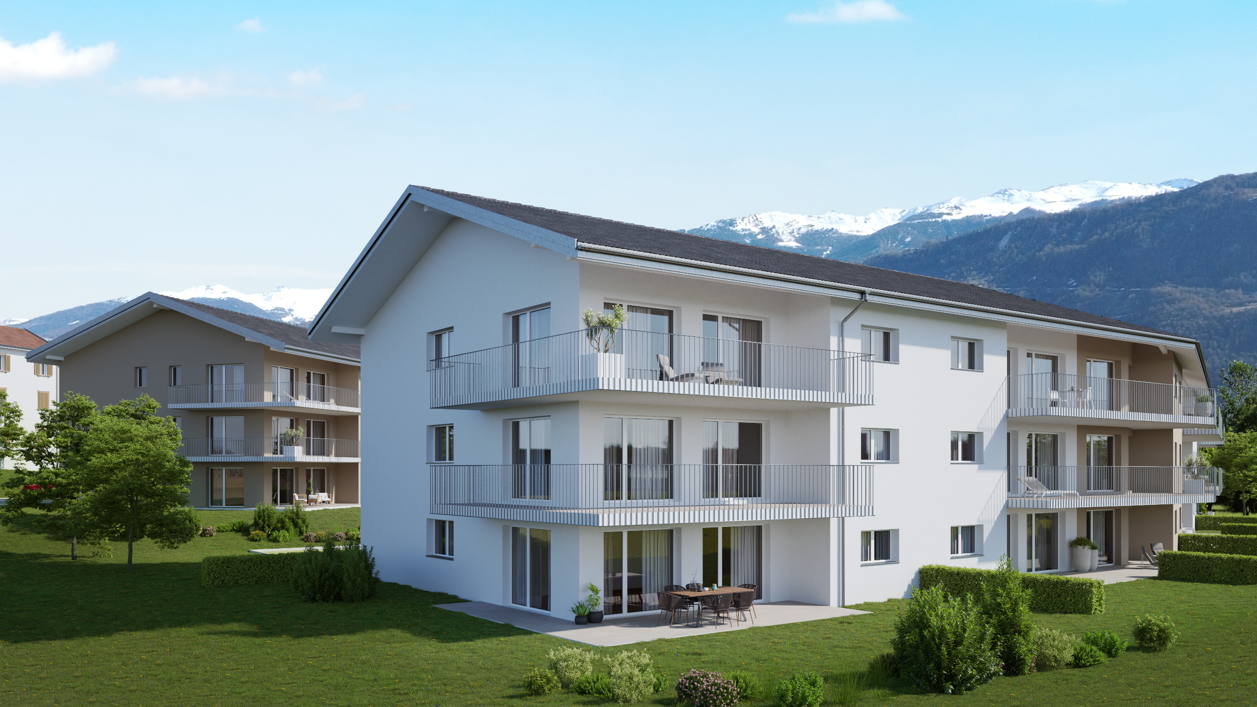 Moderne Wohnanlage mit Balkonen und Bergblick