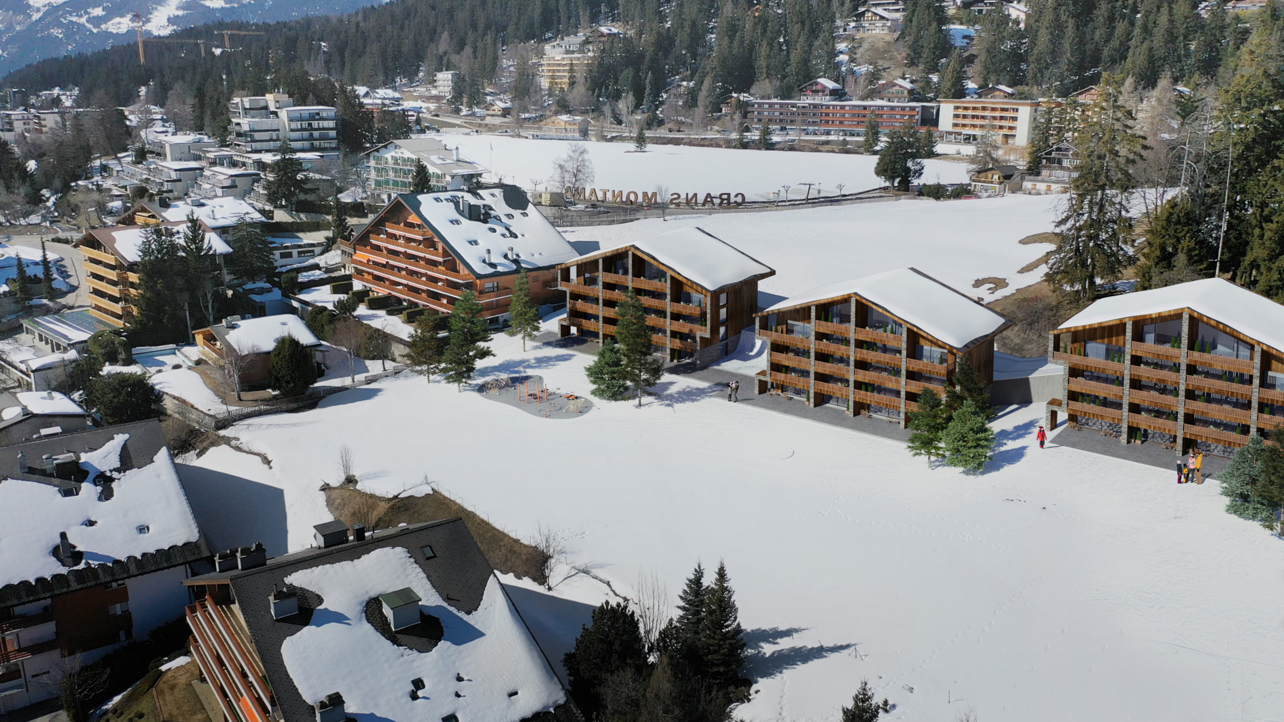 Luftaufnahme einer verschneiten alpinen Ferienanlage