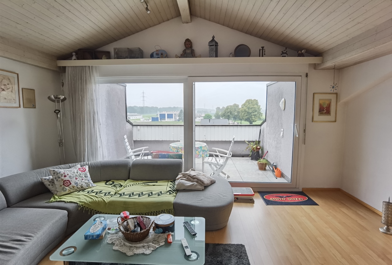 Dachgeschoss-Wohnzimmer mit Terrasse
