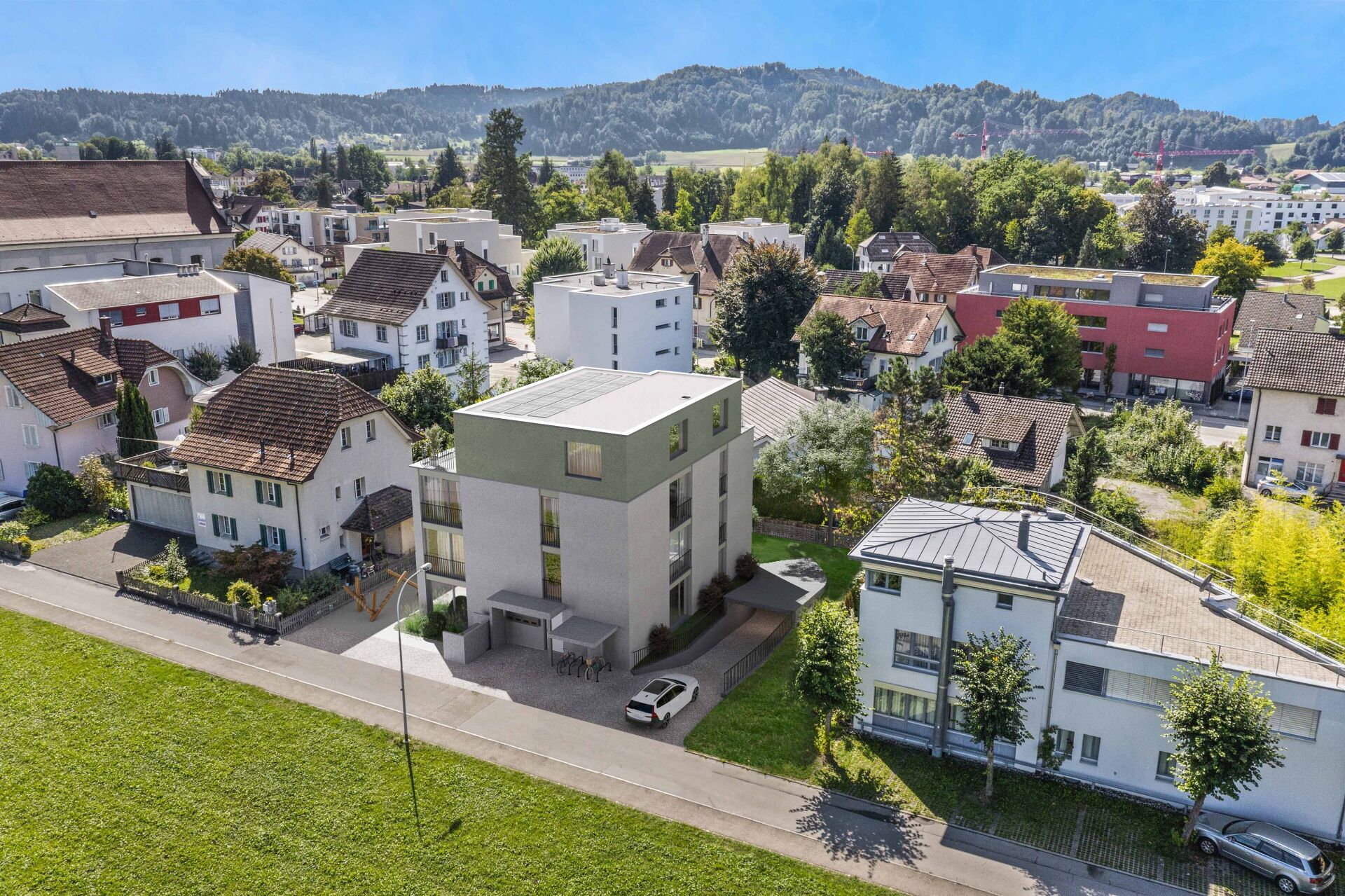 Luftaufnahme eines Wohnquartiers mit modernem Neubau