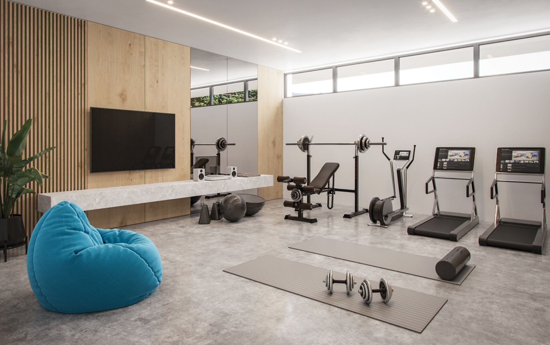 Moderner Fitnessraum mit Heimtrainingsgeräten