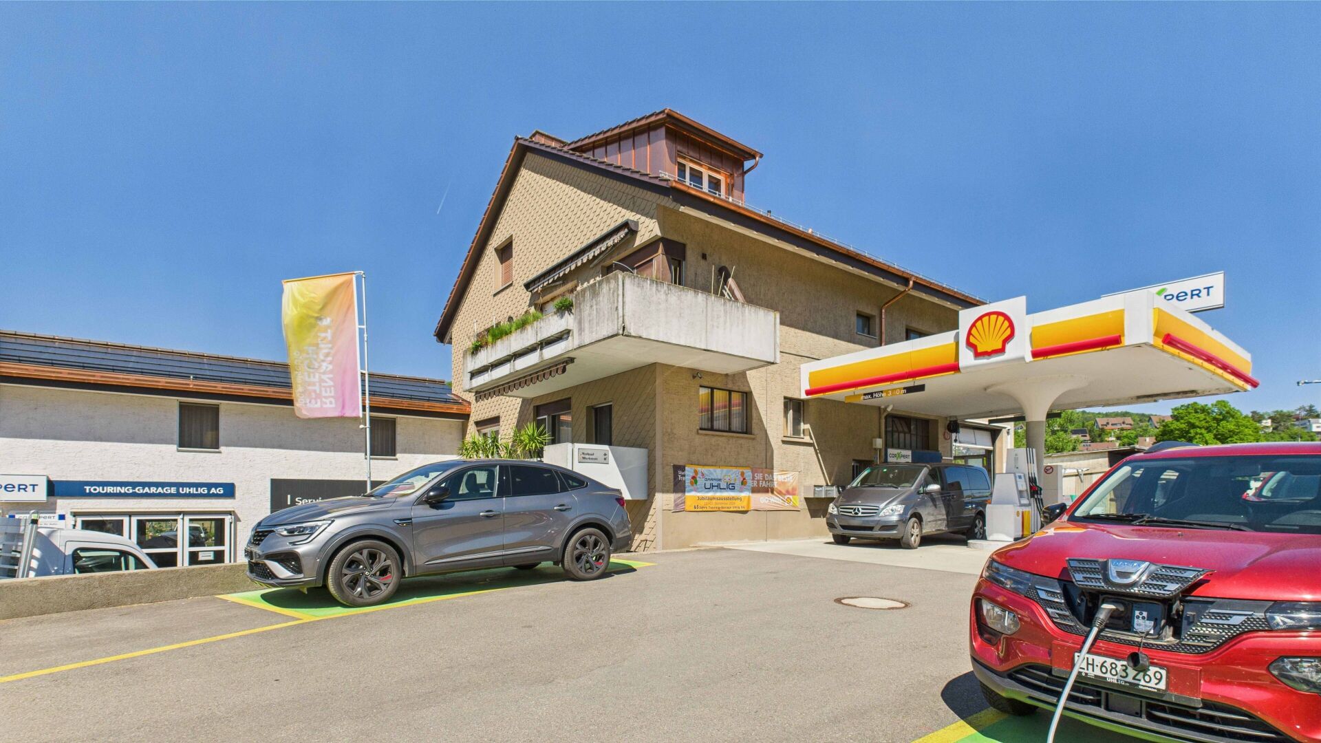 Tankstelle mit Wohn- und Gewerbebau