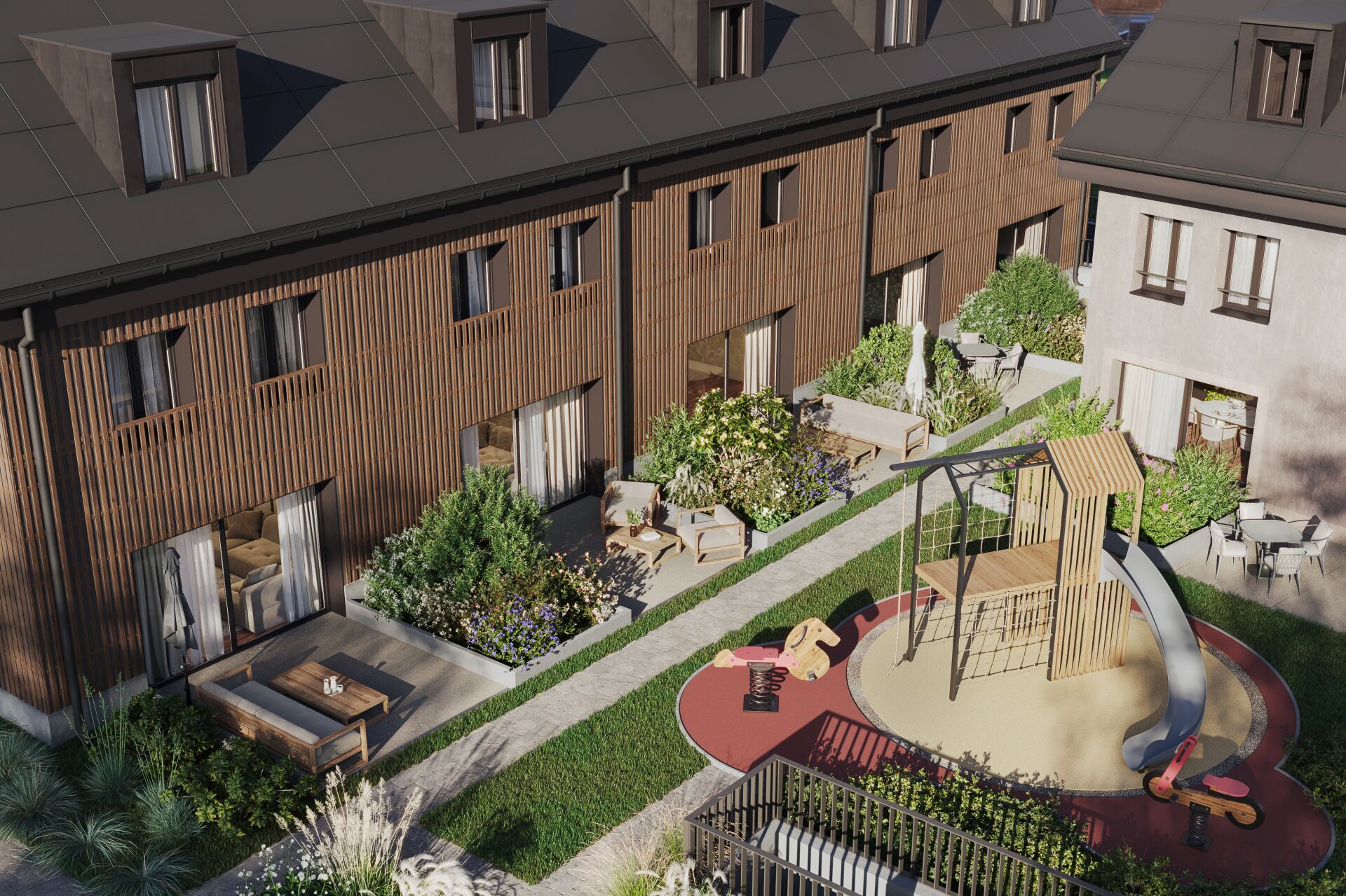 Innenhof mit Spielplatz und begrünten Terrassen