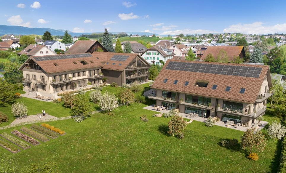 Aussicht auf mehrere Wohnhäuser mit Solardächern und großem Garten
