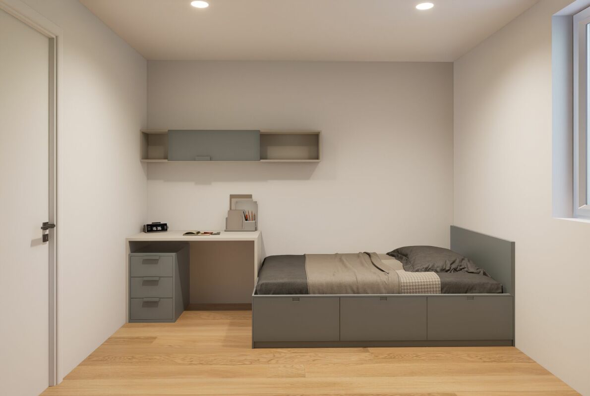 Schlichtes Schlafzimmer mit integrierter Arbeitsnische