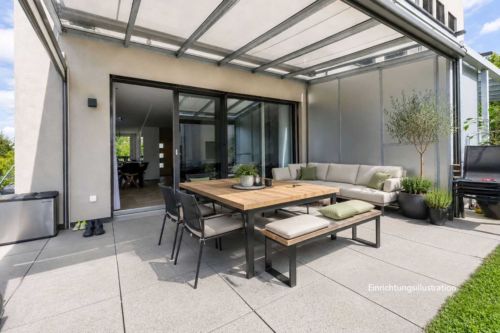 Überdachte Terrasse mit Sitzgruppe