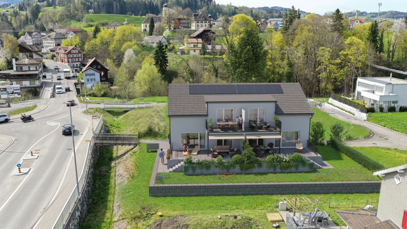Luftaufnahme eines modernen Einfamilienhauses mit Garten