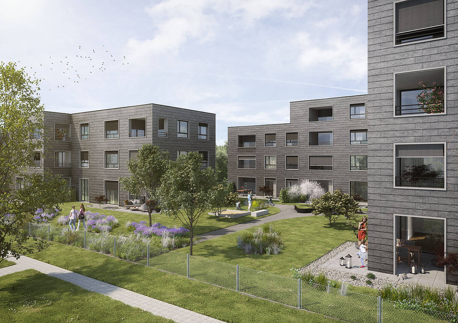 Moderner Wohnhof mit Mehrfamilienhäusern und Garten