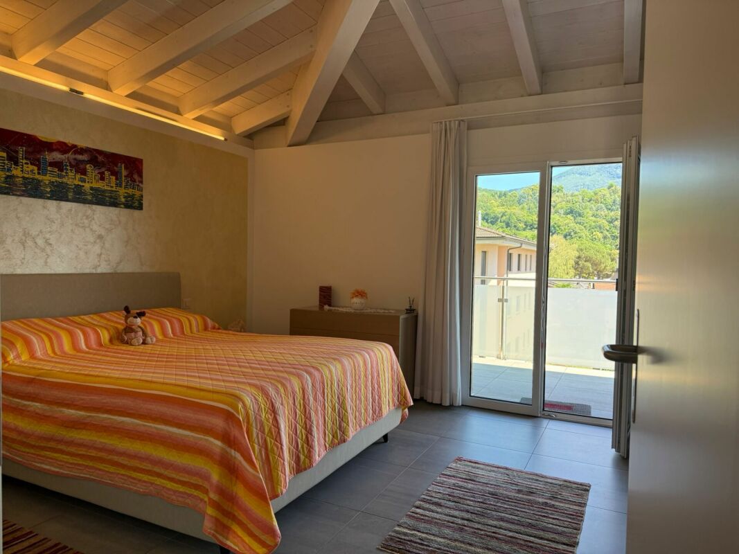 Schlafzimmer mit Balkonzugang