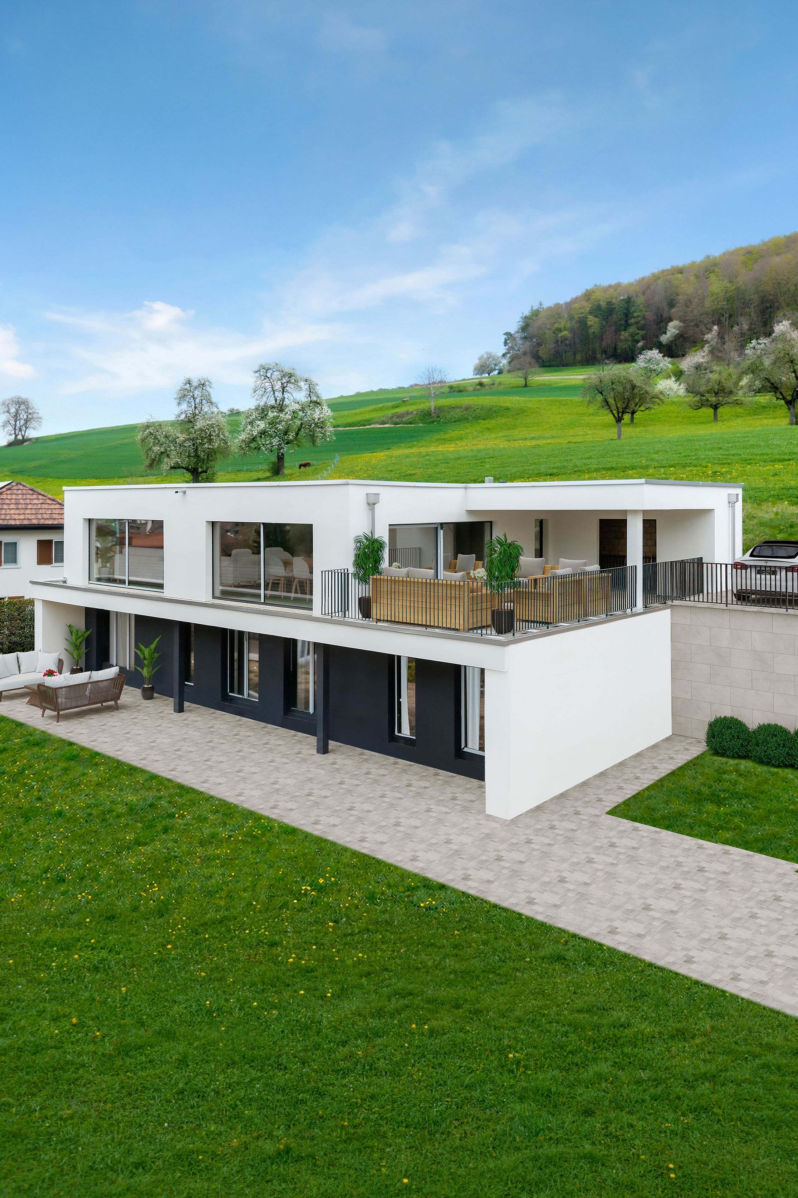 Modernes Wohnhaus mit Terrasse und Hügellandschaft