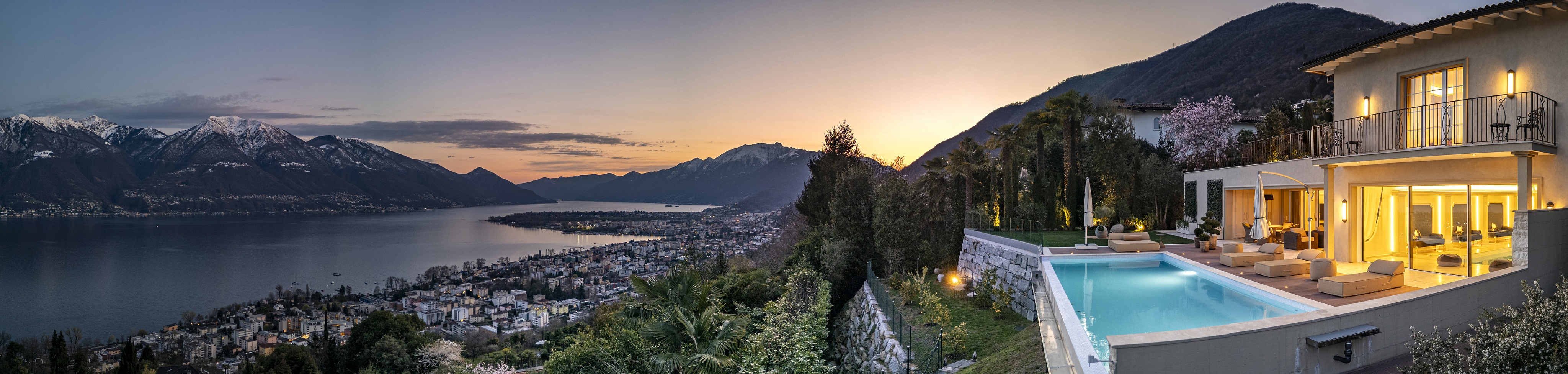 Luxusvilla mit Pool und Panoramablick am See bei Sonnenuntergang