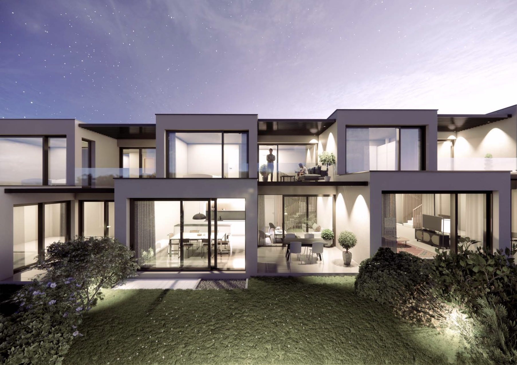 Modernes Wohnhaus mit Garten bei Nacht