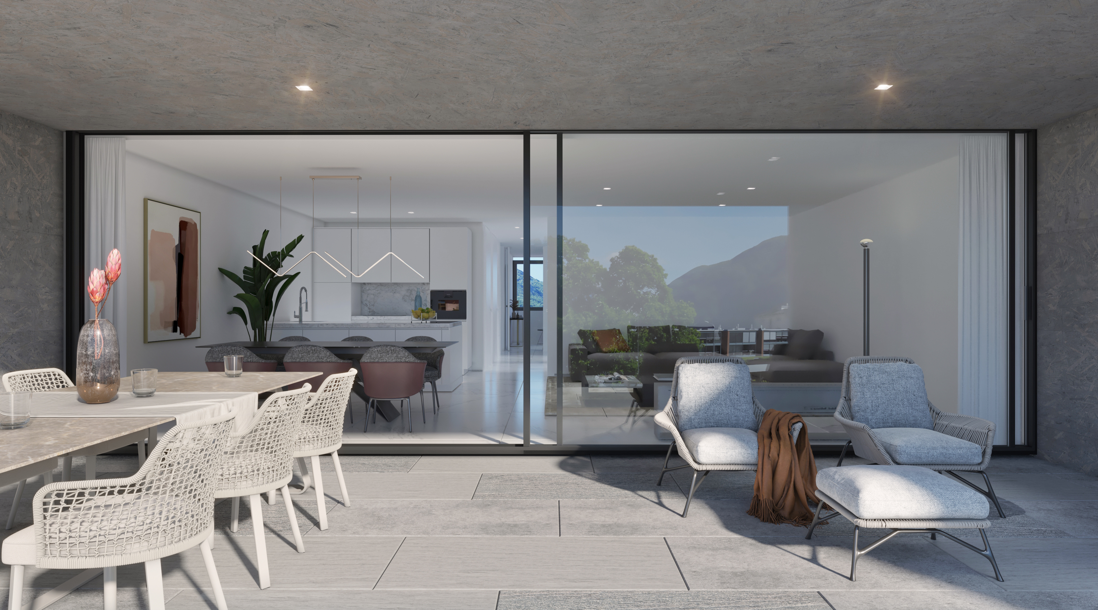 Moderne Terrasse mit Blick in den offenen Wohn- und Essbereich