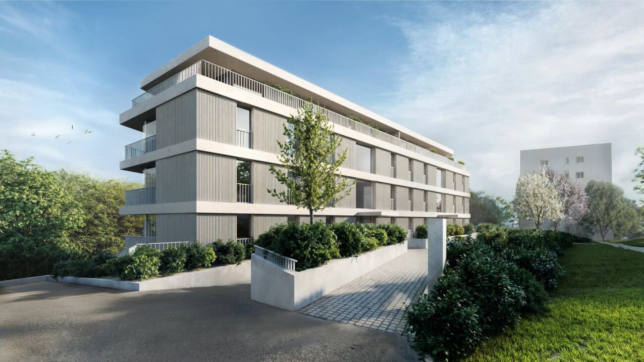 Modernes Mehrfamilienhaus mit begrüntem Umfeld