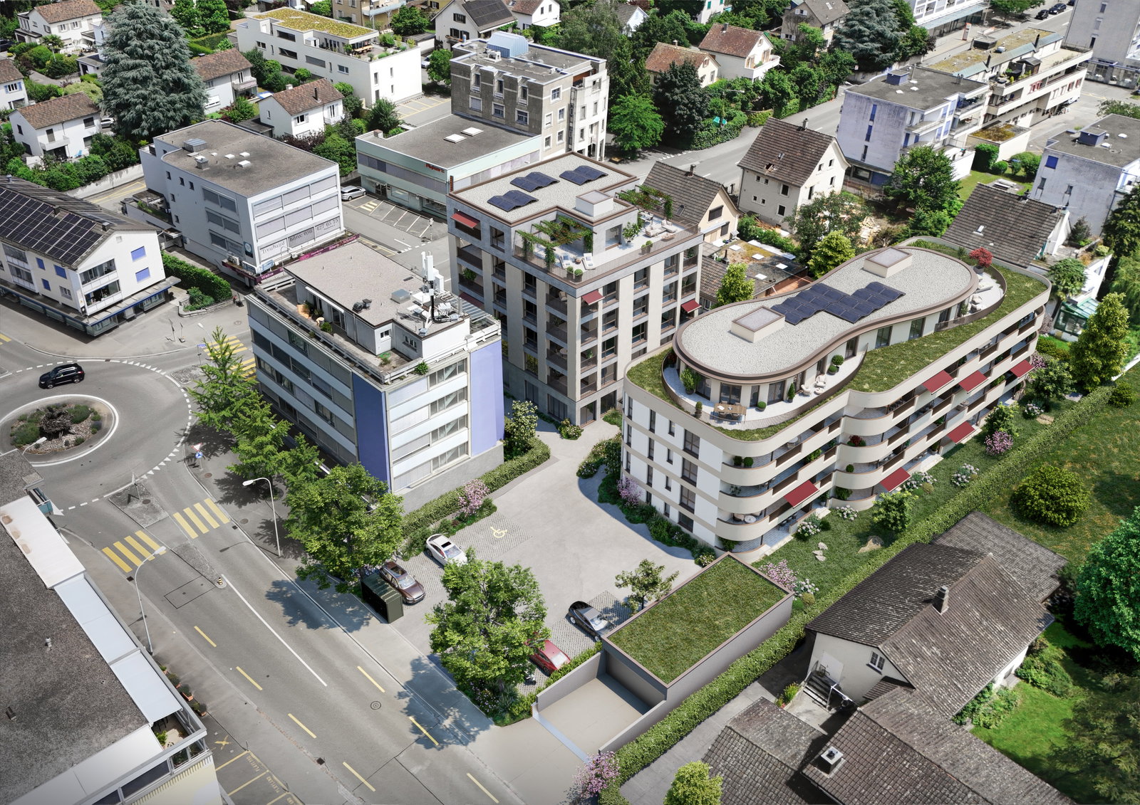Luftaufnahme eines modernen Wohnquartiers mit begrünten Flachdächern