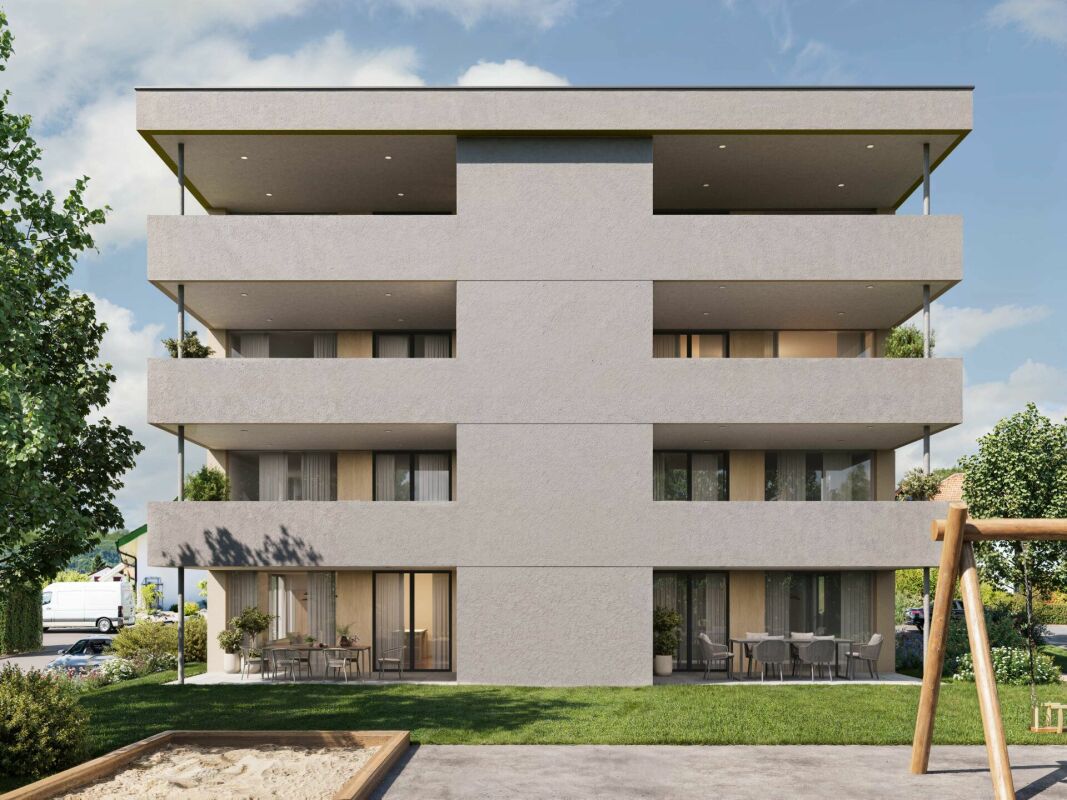 Modernes Mehrfamilienhaus mit Balkonen und Garten
