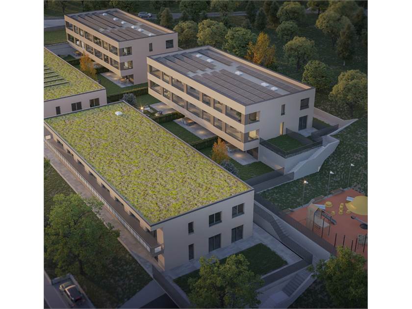 Luftaufnahme einer modernen Wohnanlage mit begrünten Dächern