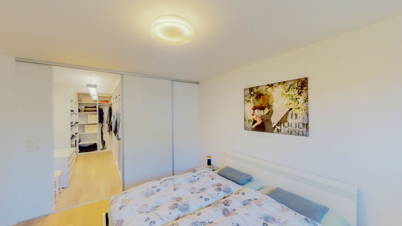 Schlafzimmer mit Ankleidebereich