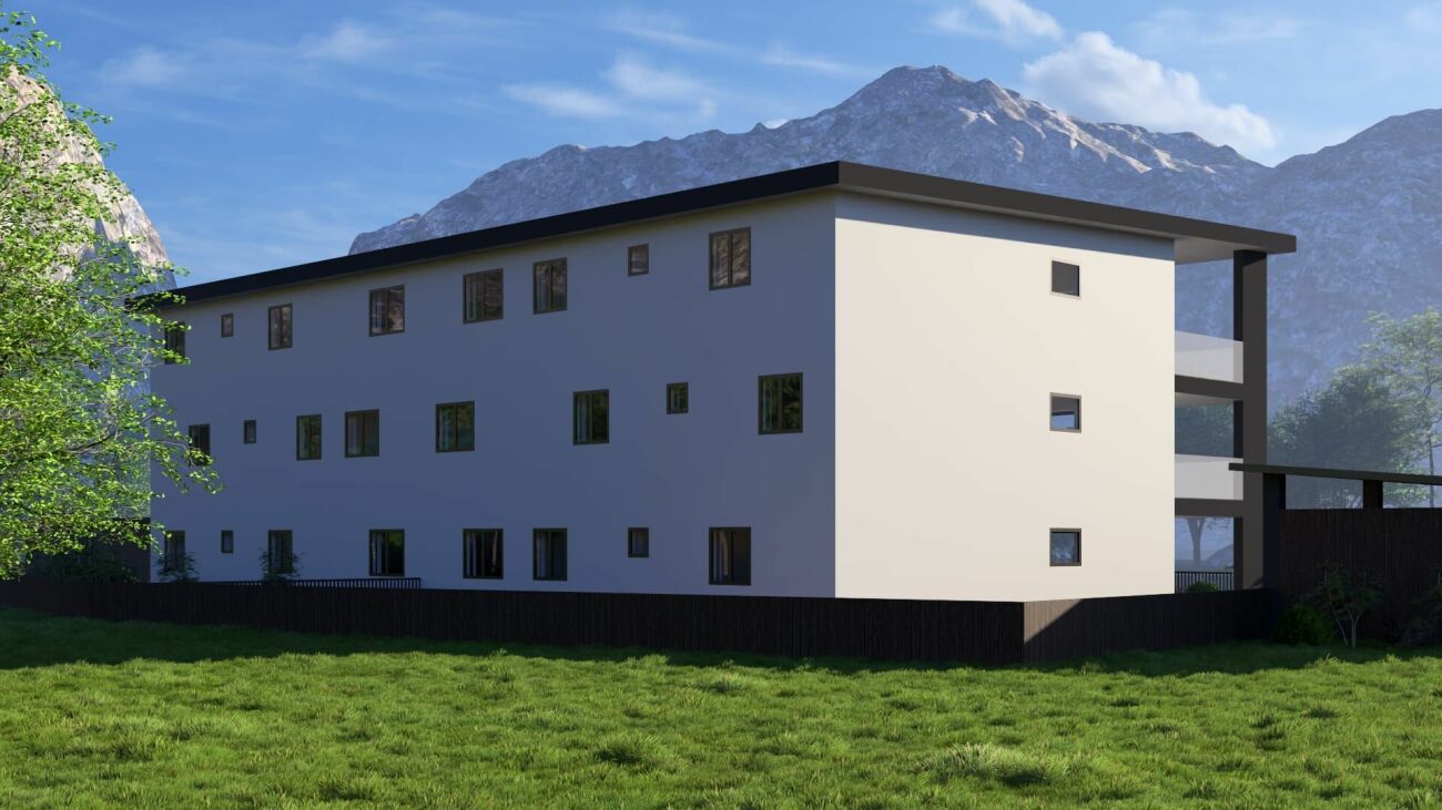 Modernes Wohngebäude mit Bergkulisse
